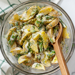 Spring Potato Salad with Asparagus and Lemon / JillHough.com Tangy with lemon, creamy with yogurt (perfect for mayo haters), and showered with fresh dill. #potatosalad #potatoes #asparagus #lemon #dill