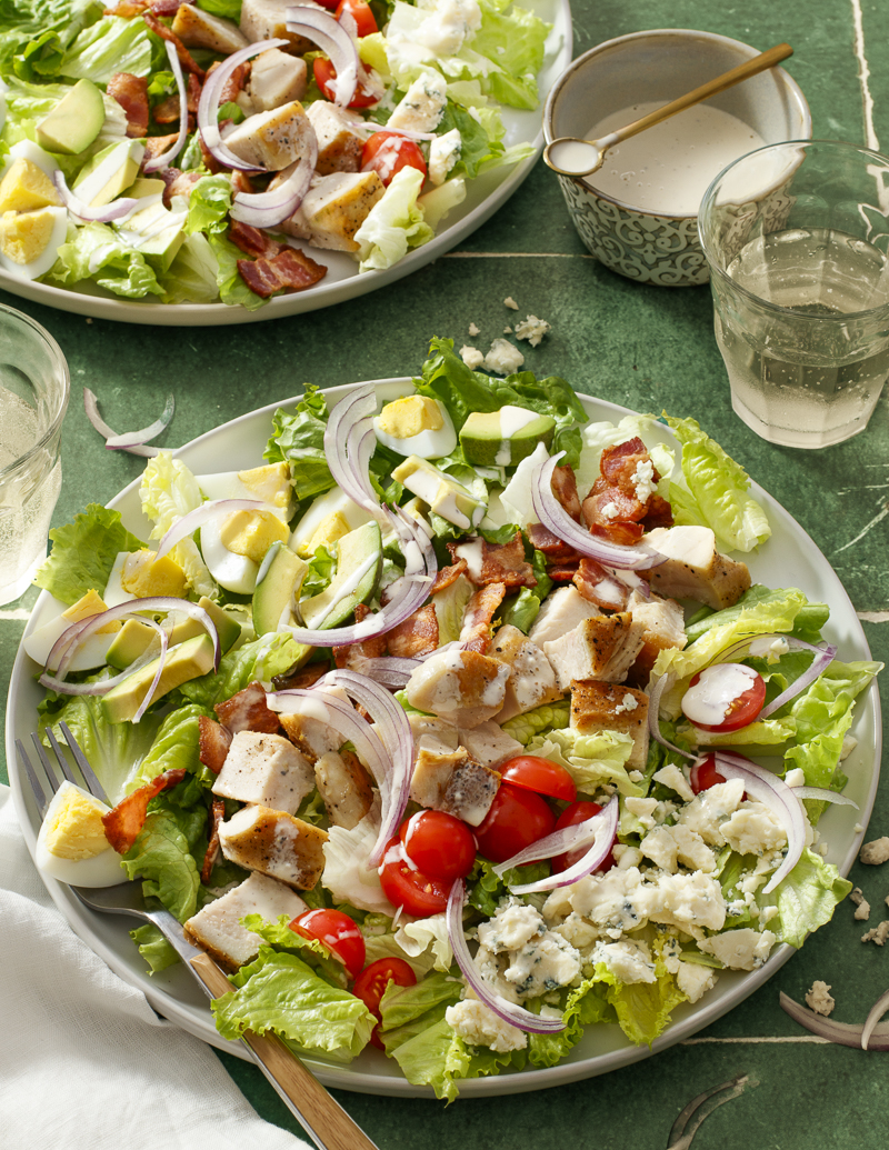 Classic Cobb Salad / JillHough.com There’s a reason this salad is a classic—loaded with chicken, bacon, avocado, blue cheese, tomatoes, and hard-cooked eggs, it’s a perfect combination of light and rich, salty and savory, refreshing and intense. #cobbsalad #classicsalad #dinnersalad #chickensalad #bacon #chicken #bluecheese #avocado #tomatoes #hardboiledeggs