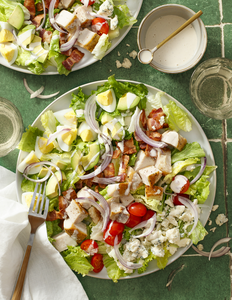 Classic Cobb Salad / JillHough.com There’s a reason this salad is a classic—loaded with chicken, bacon, avocado, blue cheese, tomatoes, and hard-cooked eggs, it’s a perfect combination of light and rich, salty and savory, refreshing and intense. #cobbsalad #classicsalad #dinnersalad #chickensalad #bacon #chicken #bluecheese #avocado #tomatoes #hardboiledeggs