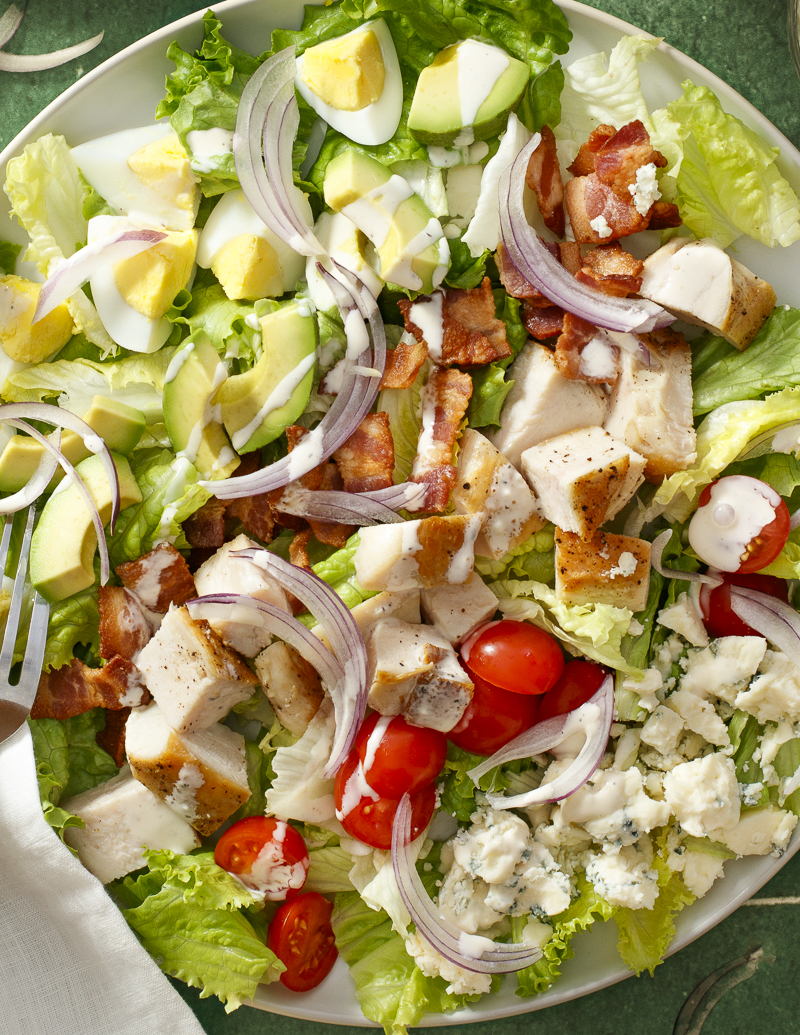 Classic Cobb Salad / JillHough.com There’s a reason this salad is a classic—loaded with chicken, bacon, avocado, blue cheese, tomatoes, and hard-cooked eggs, it’s a perfect combination of light and rich, salty and savory, refreshing and intense. #cobbsalad #classicsalad #dinnersalad #chickensalad #bacon #chicken #bluecheese #avocado #tomatoes #hardboiledeggs
