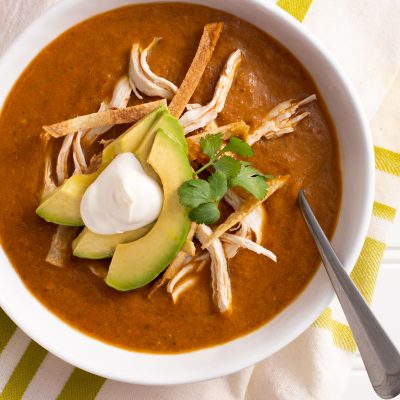 Tortilla Soup / JillHough.com A traditional pulpy base of pureed roasted vegetables adorned with bits of poached chicken, studs of creamy avocado, and shards of toasty corn tortillas.