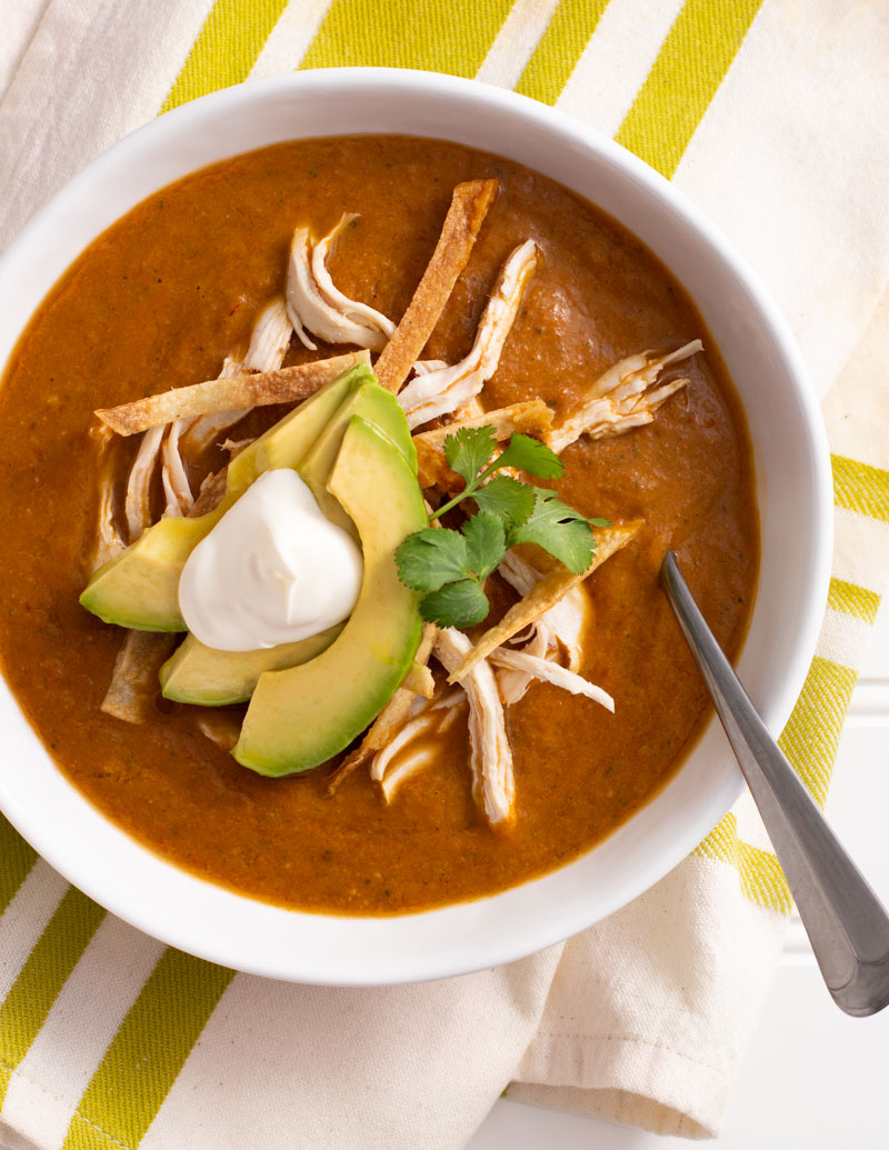 Tortilla Soup / JillHough.com A traditional pulpy base of pureed roasted vegetables adorned with bits of poached chicken, studs of creamy avocado, and shards of toasty corn tortillas.
