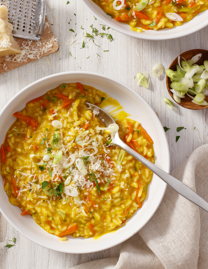 Carrot Risotto with Scallions / JillHough.com With a boost of flavor from carrot juice, its sweetness nicely balanced by savory Parmesan, and an amazing marigold color. #risotto #carrotrisotto #carrots #scallions #parmesan