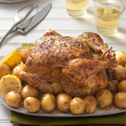 Classic Roast Chicken with Roast Potatoes / JillHough.com A lemon roasted inside the cavity gets squeezed over the final dish, giving it a brightness that takes the combination to new heights.