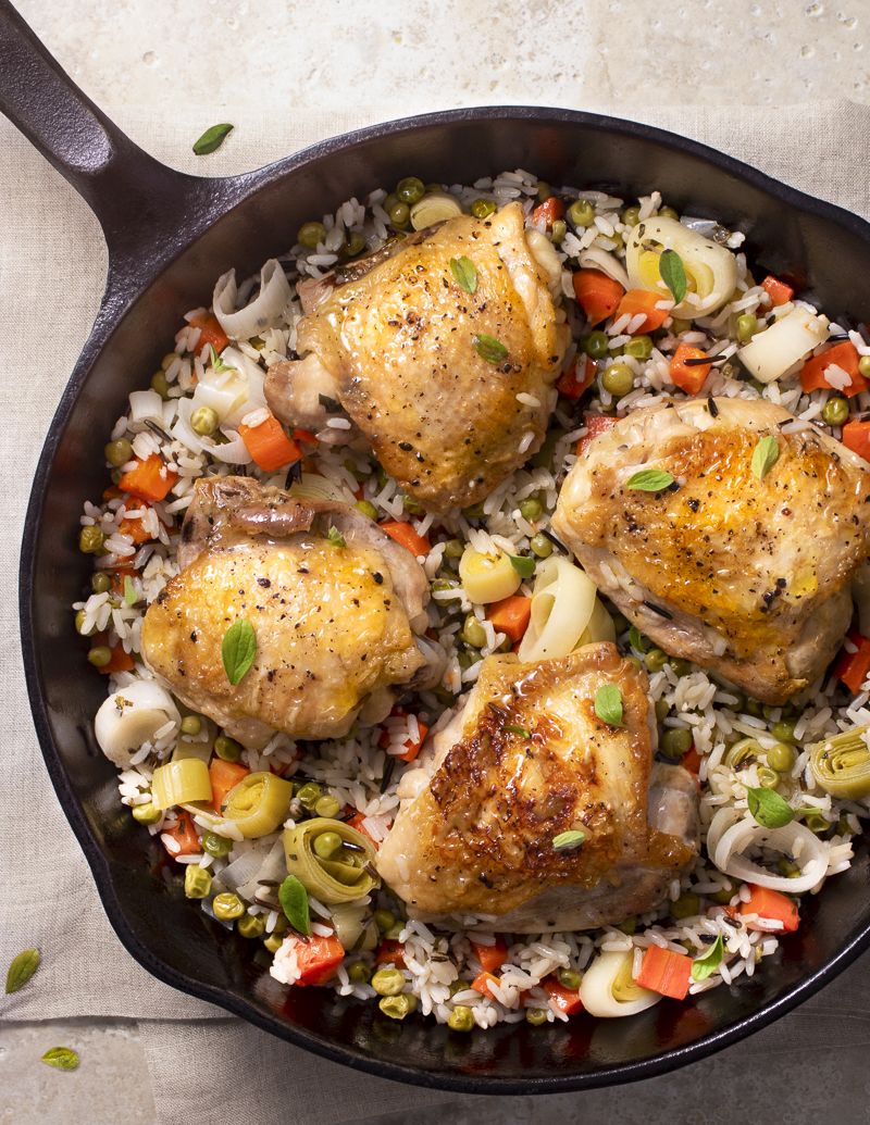Spring Chicken and Rice Stovetop Casserole / JillHough.com This one-skillet dinner features one of the all-time great combinations—chicken, rice, and seasonal vegetables. #chicken #casserole #chickencasserole #springchicken #carrots #peas #leeks