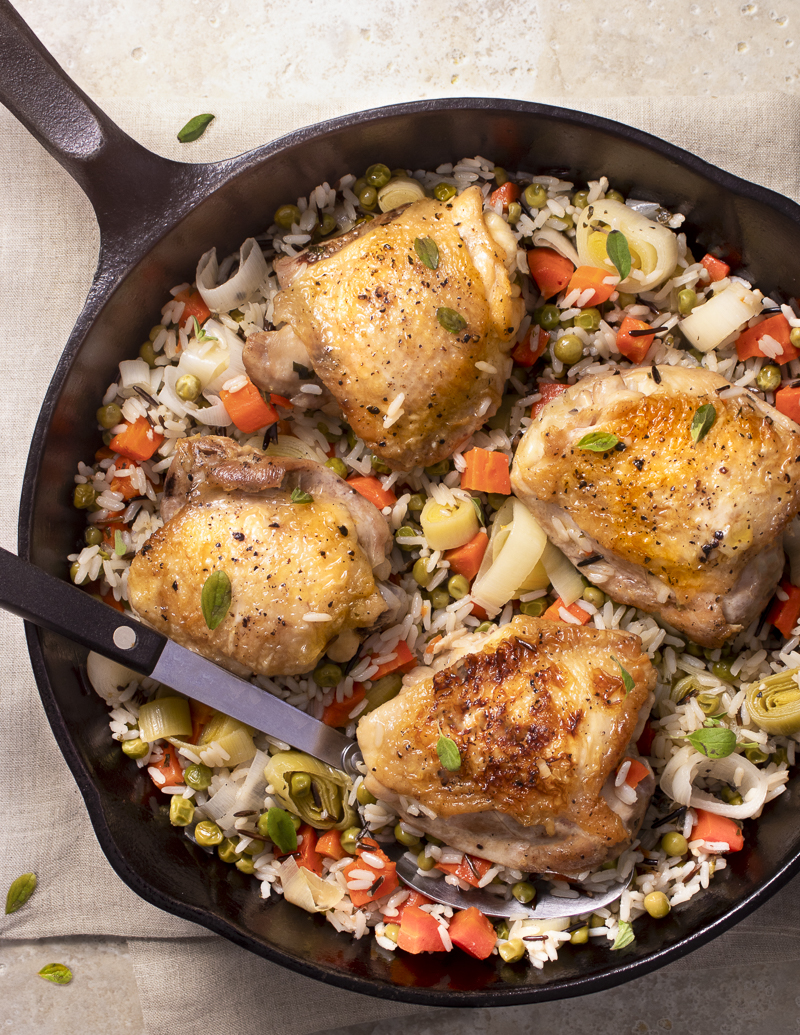 Spring Chicken and Rice Stovetop Casserole / JillHough.com This one-skillet dinner features one of the all-time great combinations—chicken, rice, and seasonal vegetables. #chicken #casserole #chickencasserole #springchicken #carrots #peas #leeks
