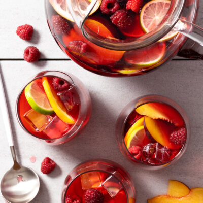 Hibiscus Sangria / JillHough.com A cool summer cocktail—like this amazing Hibiscus Sangria—is my secret ingredient for a great summer gathering. A tangy twist on the ordinary, this fruity, alcohol-optional cocktail has a tropical vibe along with lovely floral notes.