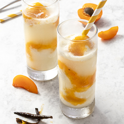 Sparkling Wine Floats with Apricot-Vanilla Sauce / JillHough.com A great way to enjoy stone fruit season, this dessert is simultaneously elegant and playful. #apricots #icecream #sparklingwine #winefloat #winedessert #apricot #champagne