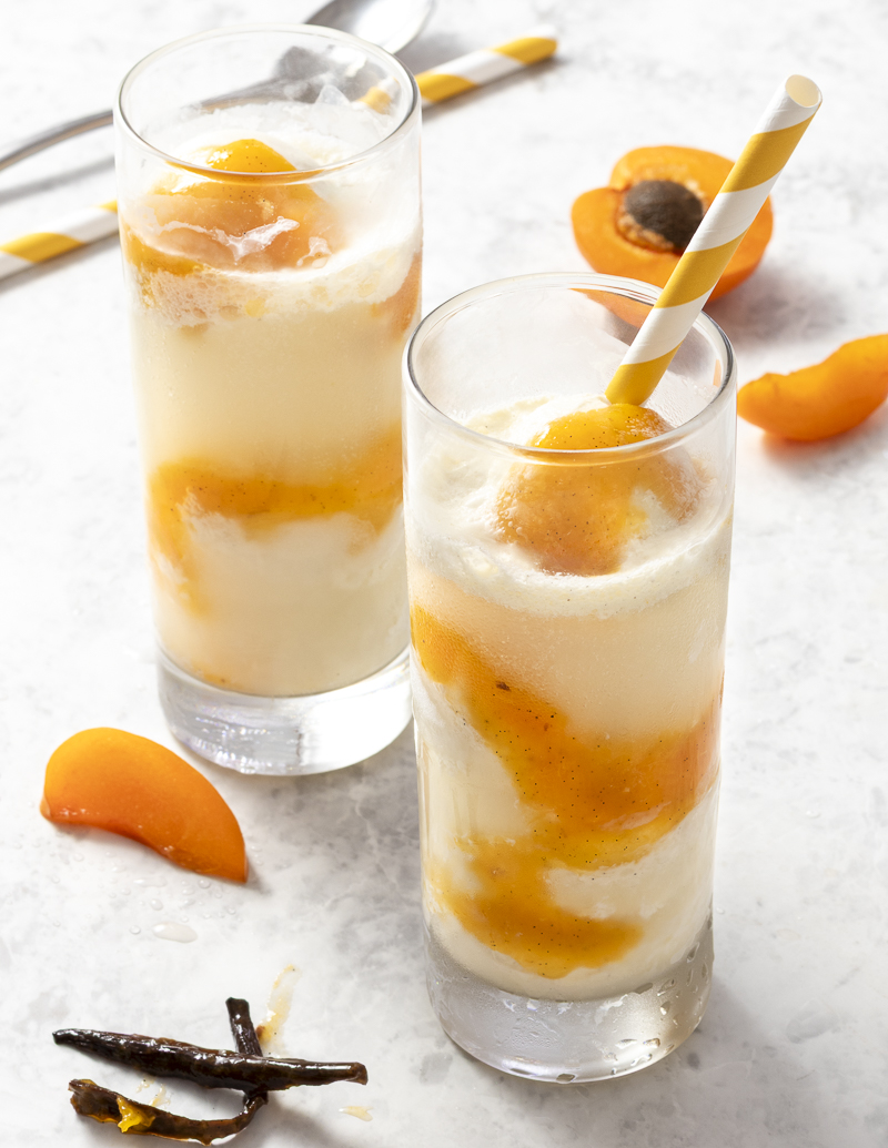 Sparkling Wine Floats with Apricot-Vanilla Sauce / JillHough.com A great way to enjoy stone fruit season, this dessert is simultaneously elegant and playful. #apricots #icecream #sparklingwine #winefloat #winedessert #apricot #champagne