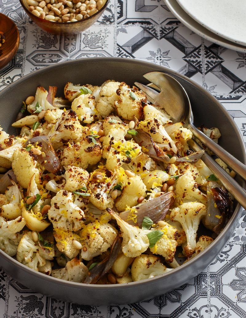 Roasted Cauliflower and Shallots with Oregano and Lemon / JillHough.com Cauliflower, shallots, garlic, olive oil, yum. But oregano, lemon zest, pine nuts, and optional red pepper flakes send it over the top. #cauliflower #shallots #oregano #lemon #roastedvegetables