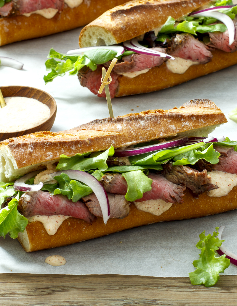 Spicy Steak and Parmesan Sandwiches / JillHough.com This quick and crowd-pleasing steak sandwich, slathered with a Parmesan- and horseradish-laced mayonnaise, is hearty with a pleasant kick. #steak #sandwich #steaksandwich #grilledsteak #mayonnaise #horseradish #spicy
